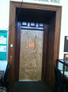The door to Dana boarded up and bid good-bye with a Post-It note. Bye-bye!
