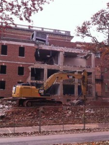 A small machine with a jackhammer is inside the 3rd floor.